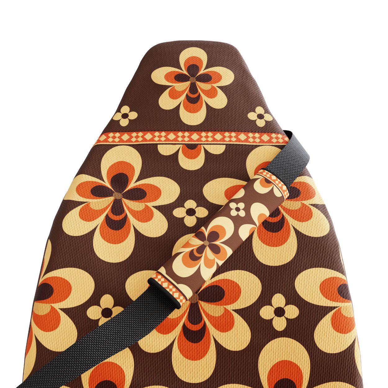 Sedona seat belt sleeve detail showing red Aztec geometry and folk-illustrated flowers | Solara Covers