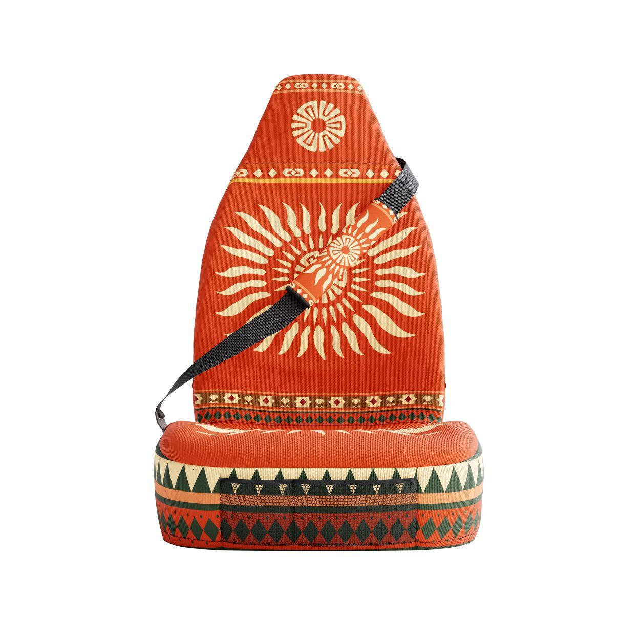 Sol seat belt sleeve detail showing warm orange and red Aztec geometric pattern | Solara Covers