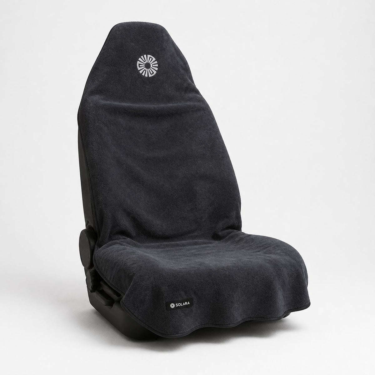 Neblina grey car seat towel by Solara on a car seat, angled view from the right