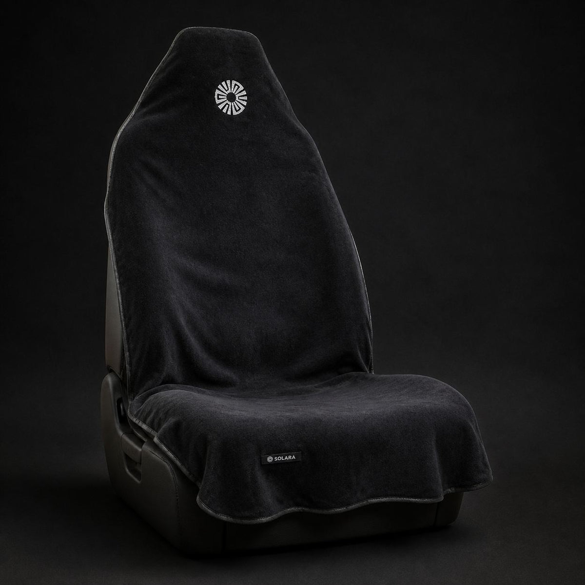 Noche black car seat towel by Solara on a car seat, studio shot