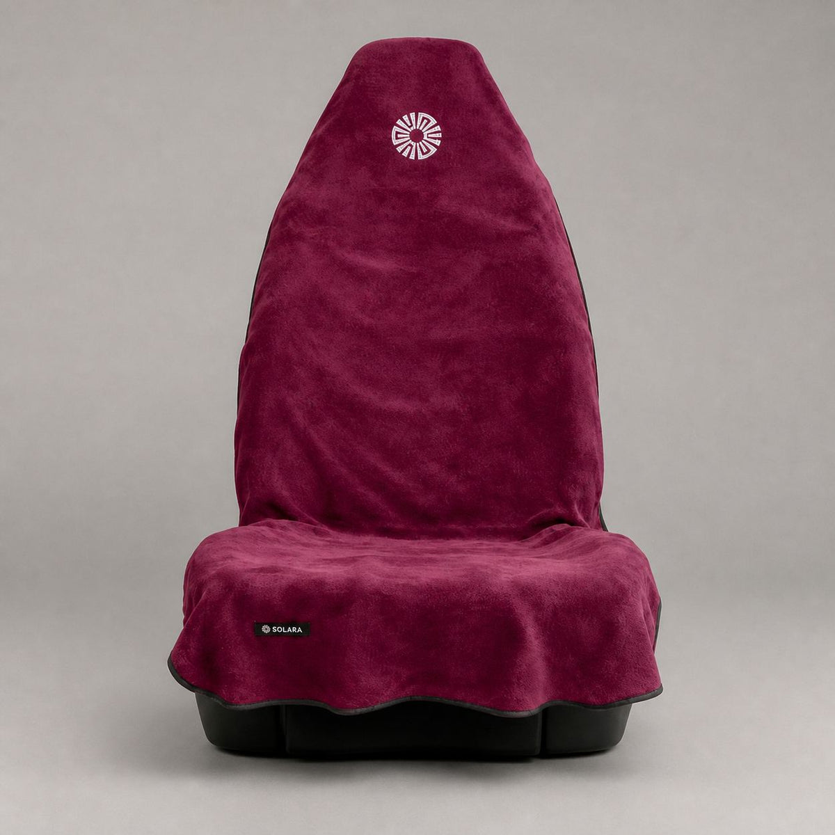 Rosa pink car seat towel by Solara covering a front car seat, front view