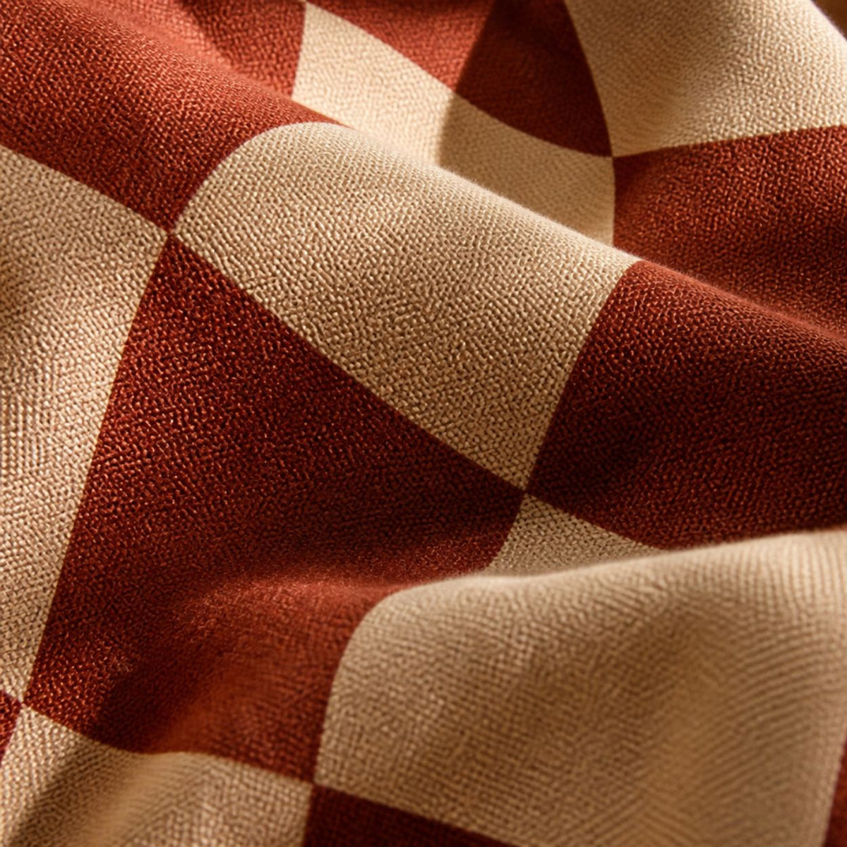 Close-up of the Terra weave — warped red and cream checks