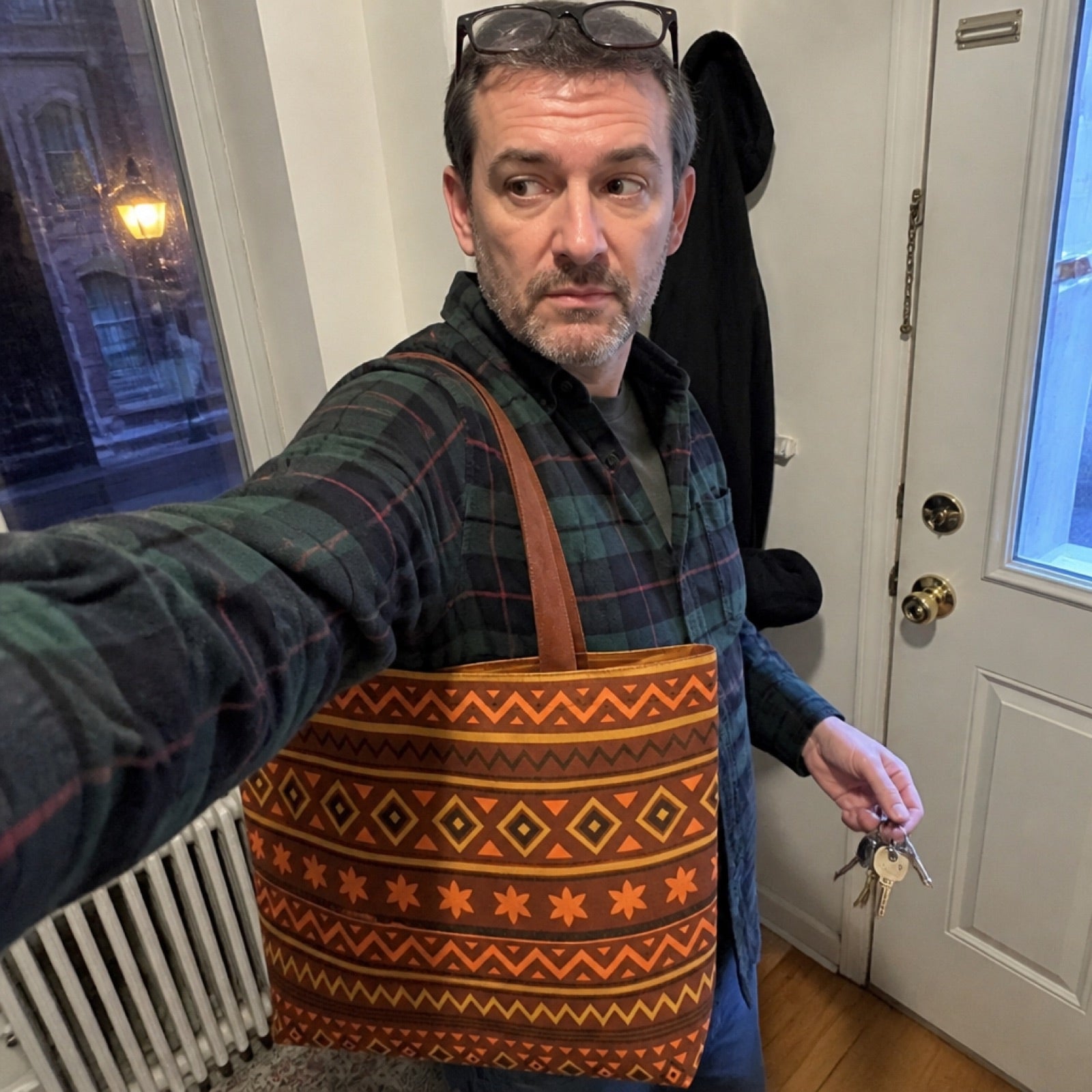 Aztec-print tote bag carried over the shoulder