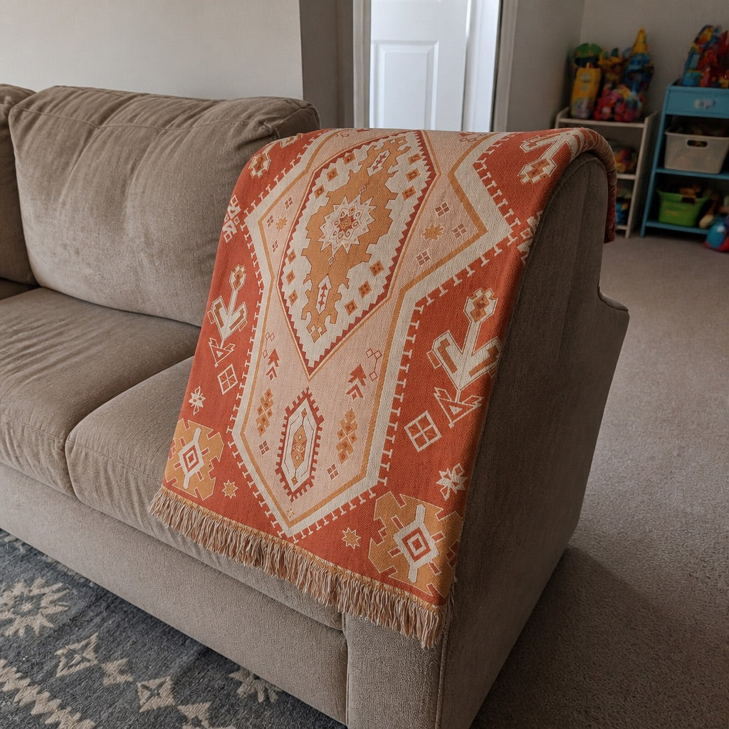 Woven boho blanket used as a beach mat