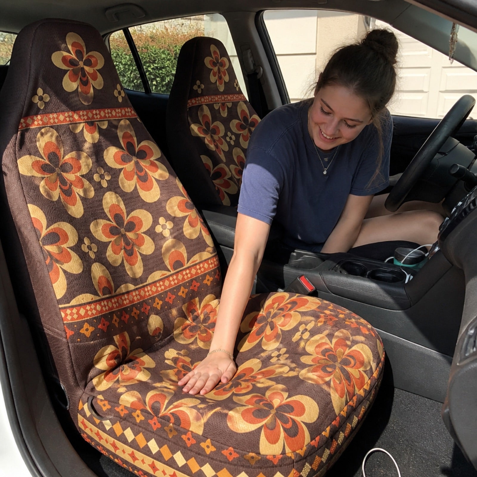 Sand-tone boho seat covers installed on a car's front seats