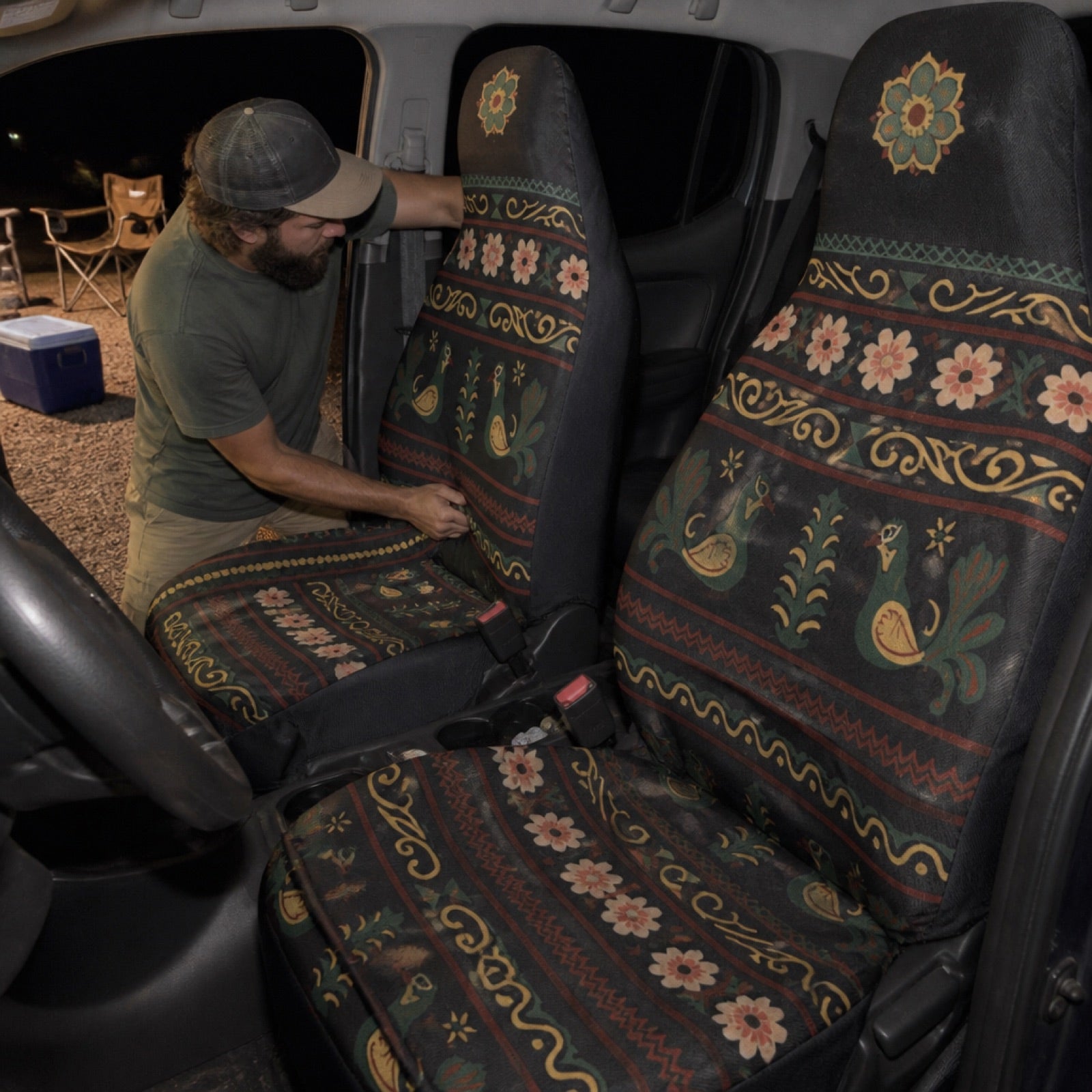 Dark folk print seat covers on van seats at a campsite | Solara Covers
