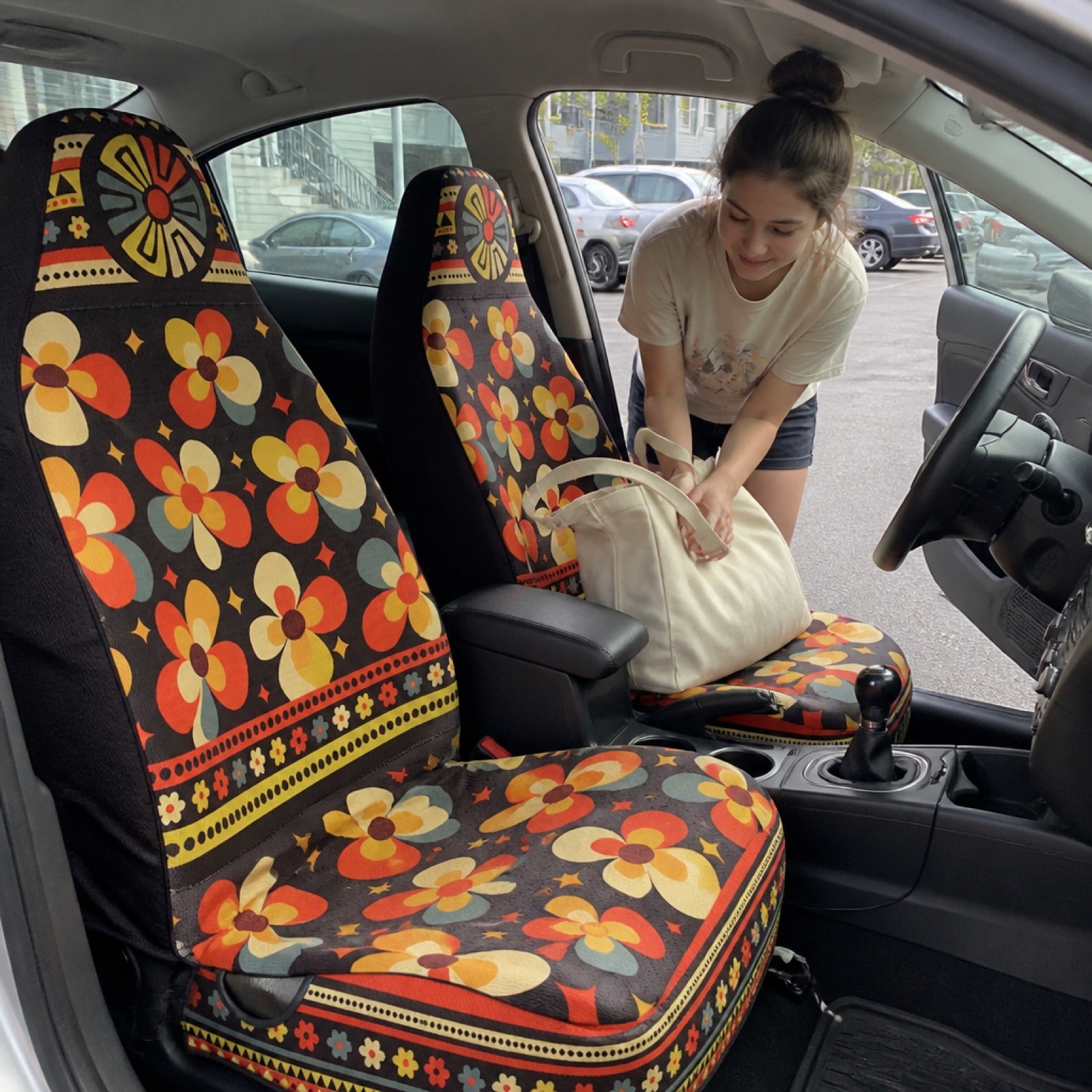 Serape blanket-print seat covers on a car's front seats