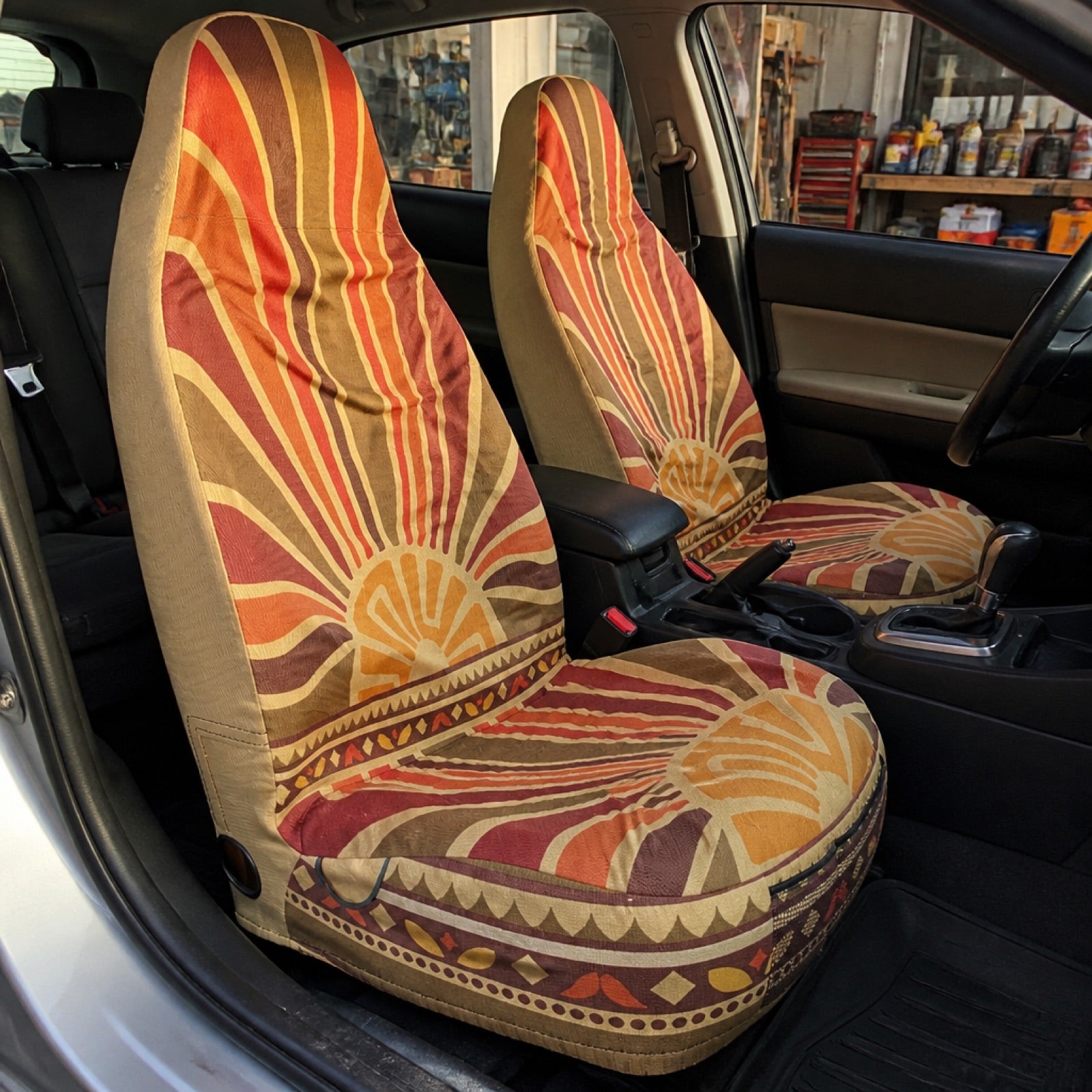 Deep blue boho seat covers installed on a car's front seats