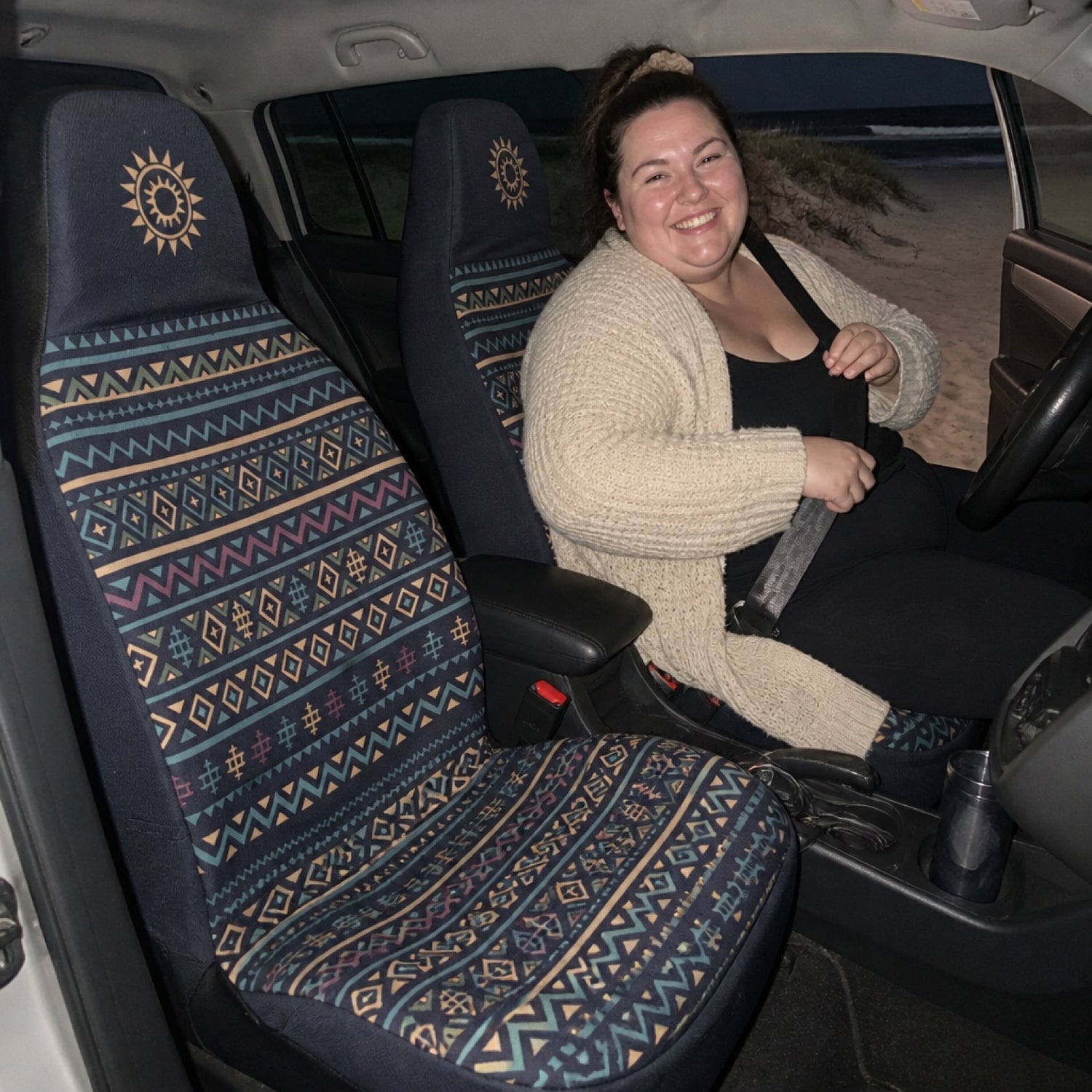 Terracotta-toned seat covers installed on a car's front seats