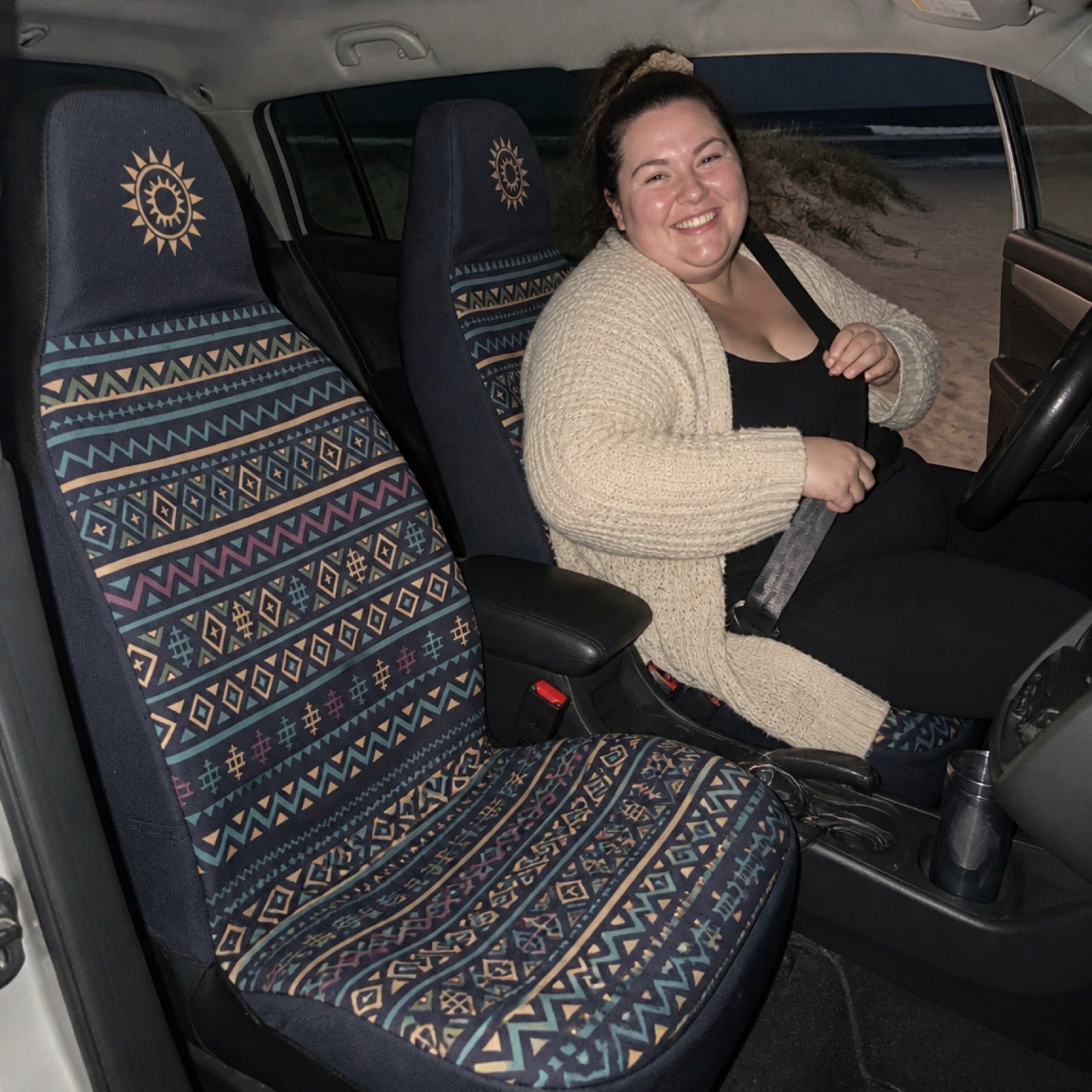 Terracotta-toned seat covers installed on a car's front seats