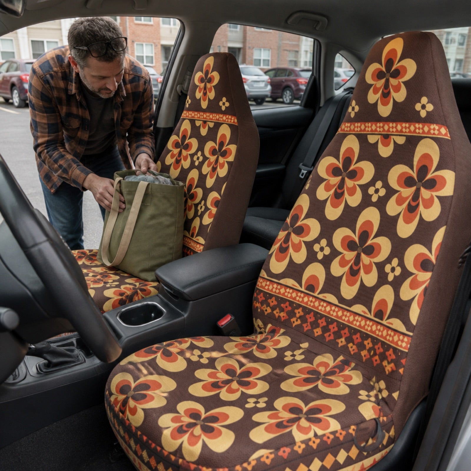 Boho seat covers installed on the front seats of a camper van
