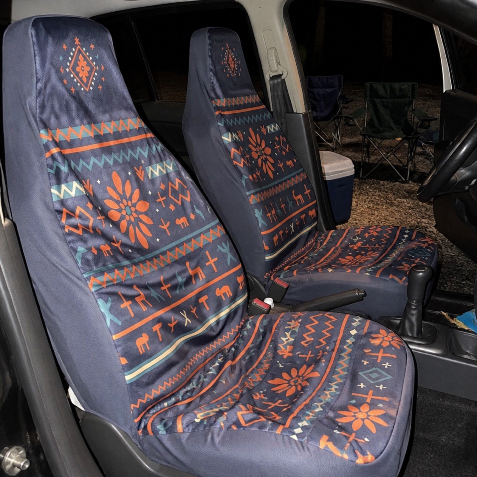 Navy and orange folk print seat covers in a midsize truck | Solara Covers