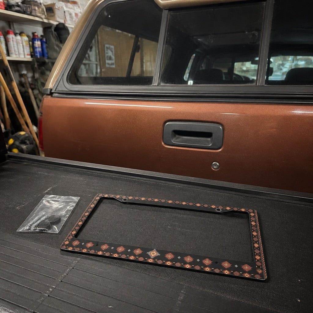 Patterned license plate frame on a car's front bumper