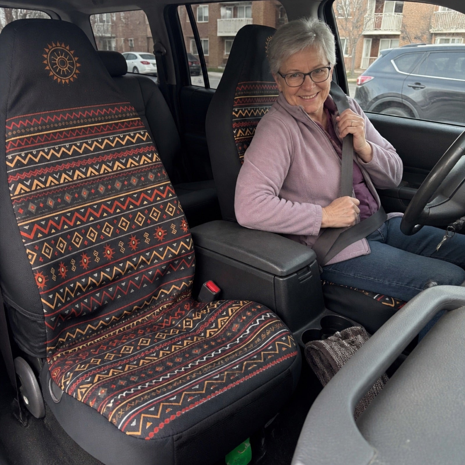 Boho seat covers installed on the front seats of a GMC truck