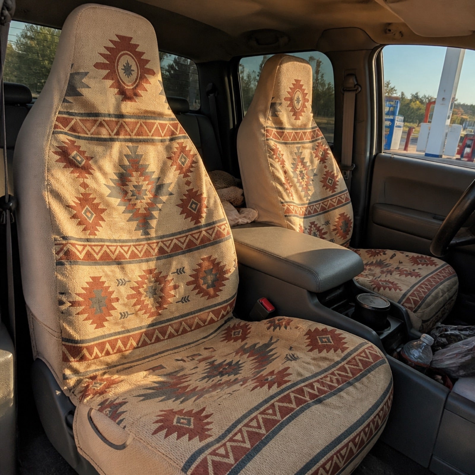 Boho seat covers installed on the front seats of a Jeep Cherokee