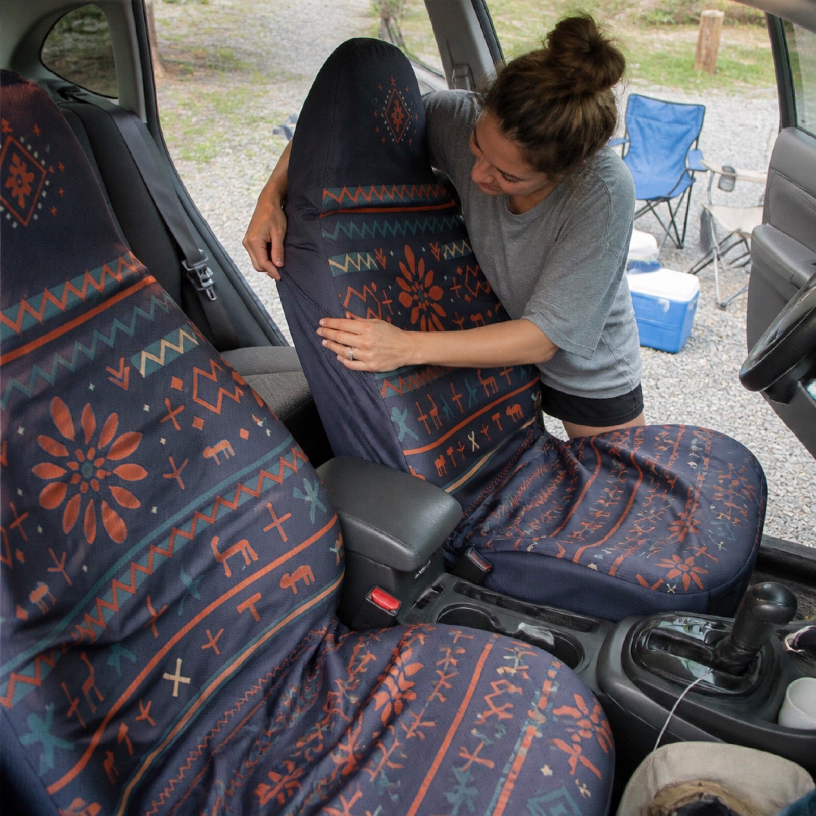 Navy and orange folk print seat covers in a midsize truck cab | Solara Covers