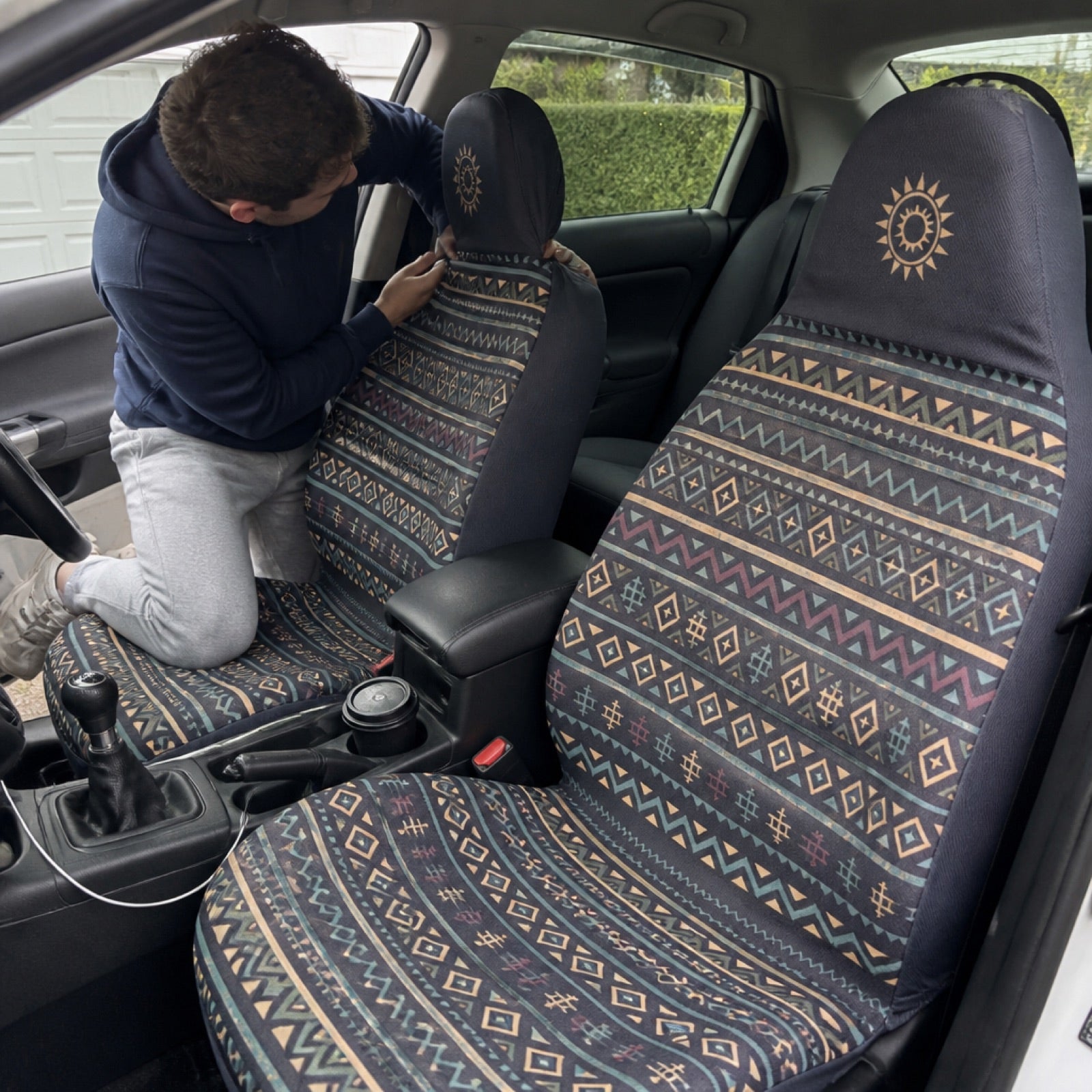 Boho seat covers installed on the front seats of a Nissan Pathfinder