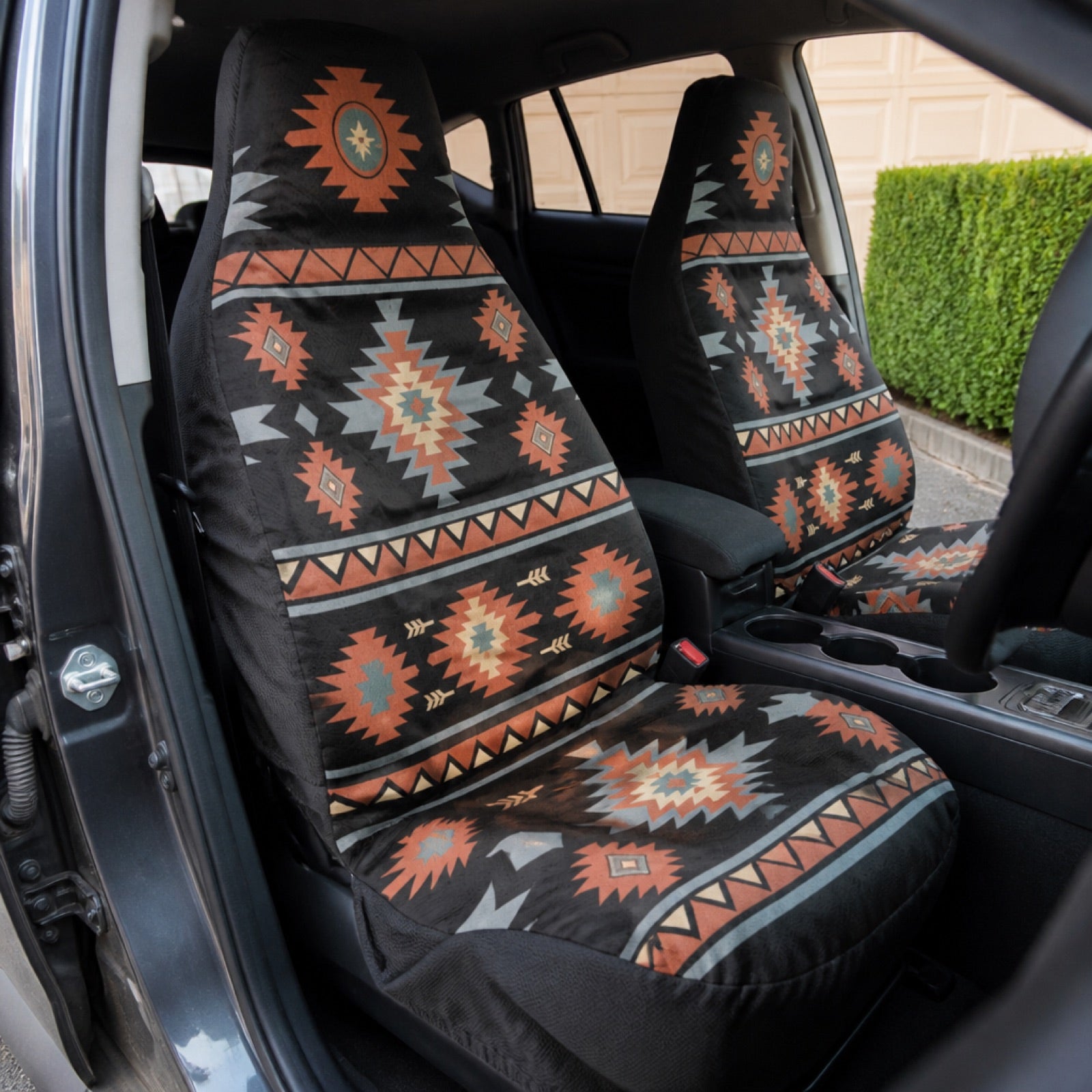Patterned boho seat covers installed on a car's front seats