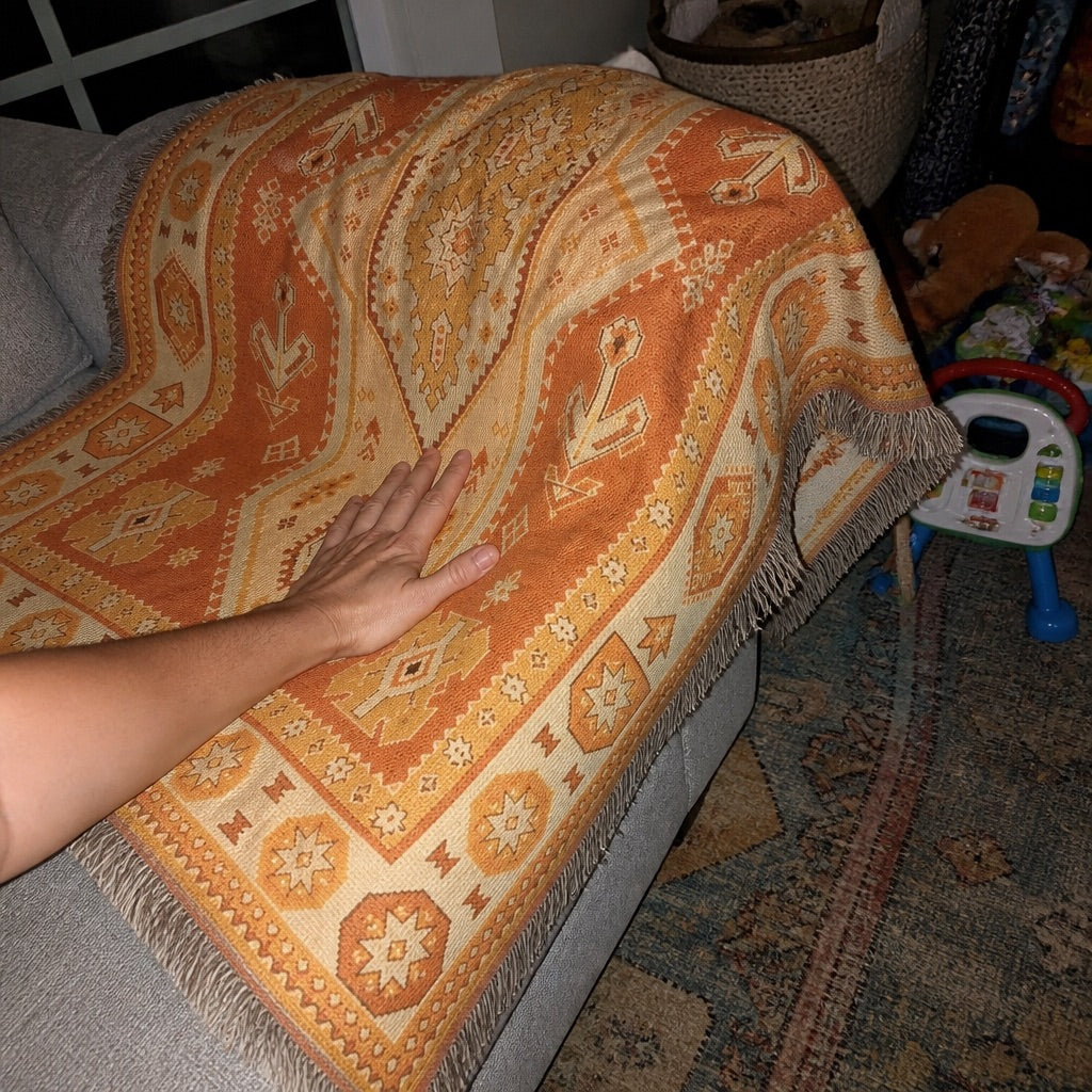 Woven boho blanket set up for a picnic