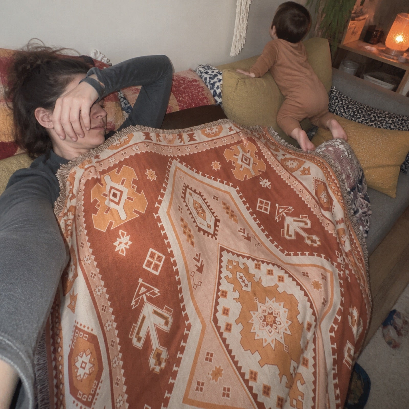 Woven boho blanket spread out at the beach