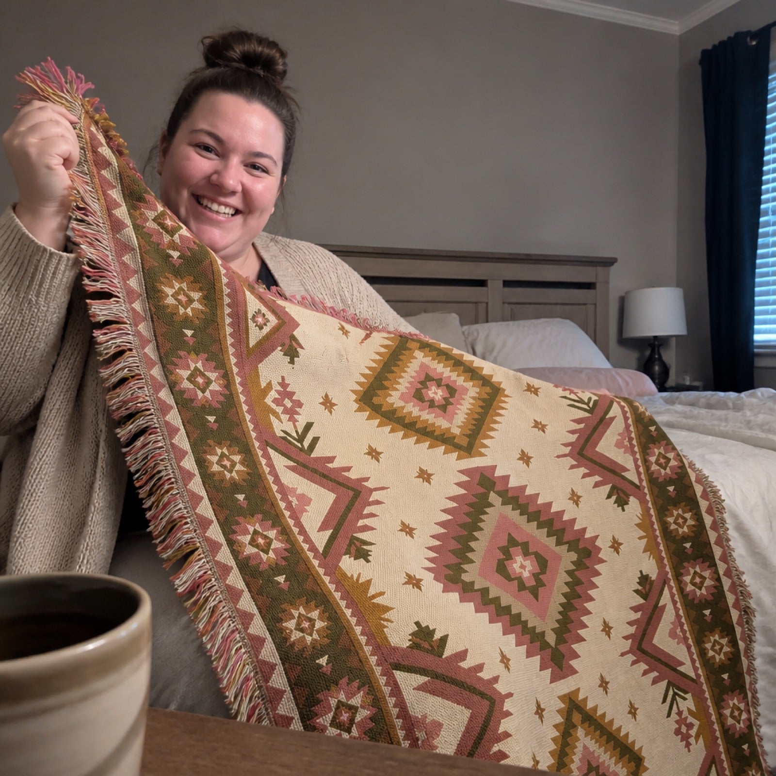 Woven throw blanket draped over a couch