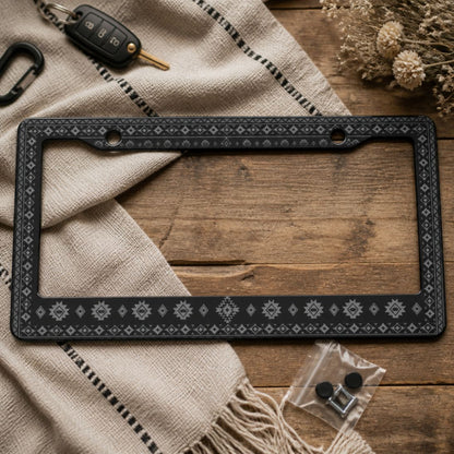 Karma license plate frames — monochrome Aztec pattern close-up | Solara