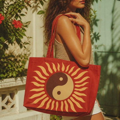 Tao rust-red tote bag carried over the shoulder in a garden courtyard