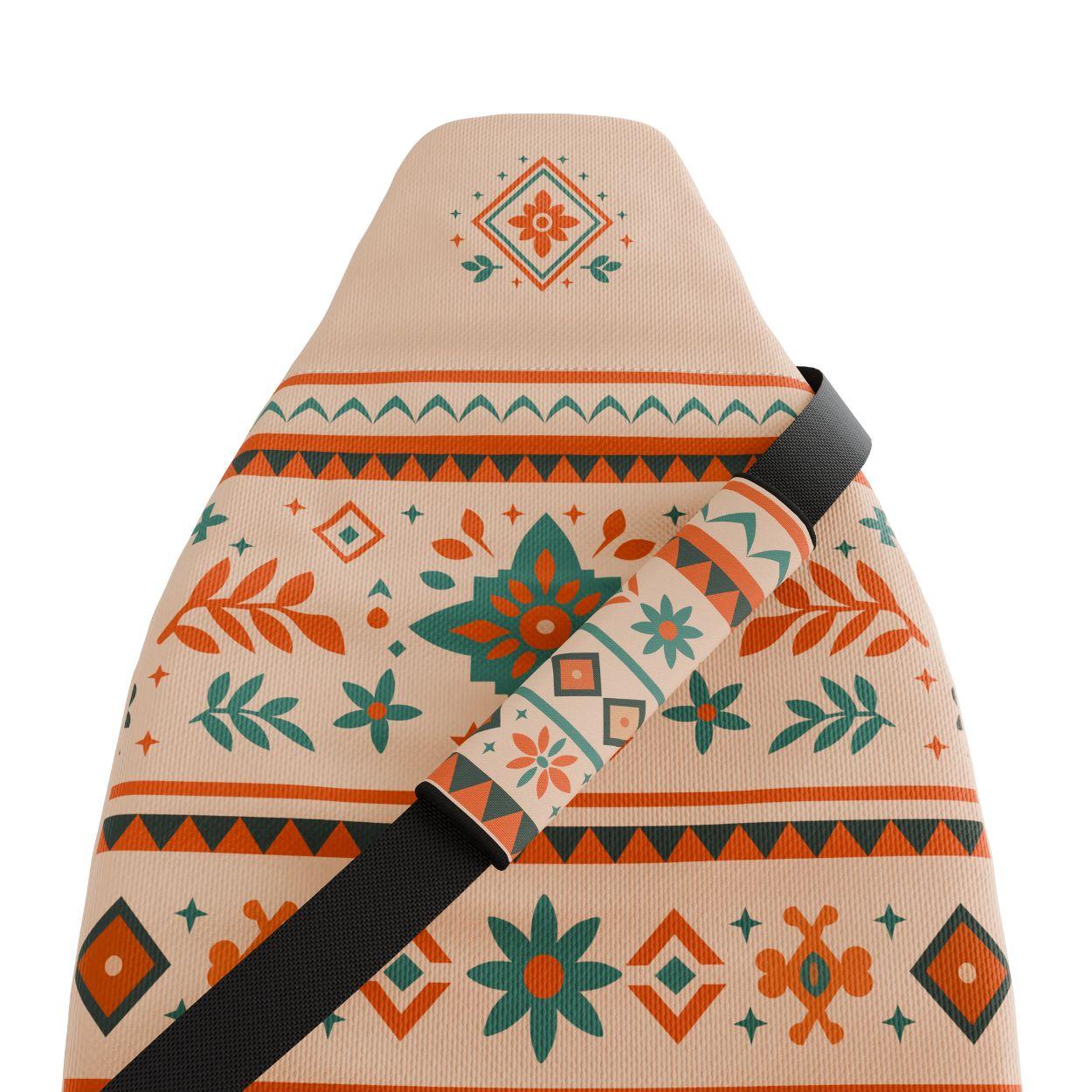 Sierra seat belt covers pair installed in van — cream, red and teal Southwest padded sleeves | Solara Covers