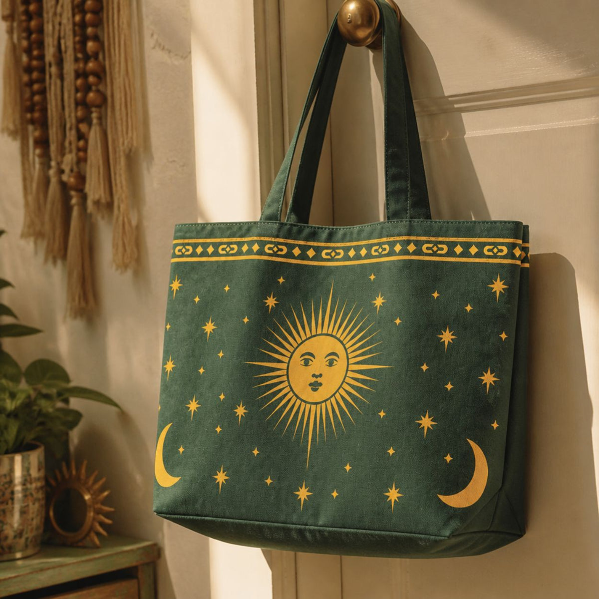 Astra tote bag hanging on a door hook beside macramé