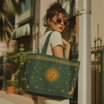 Astra celestial tote bag over the shoulder on a sunny street