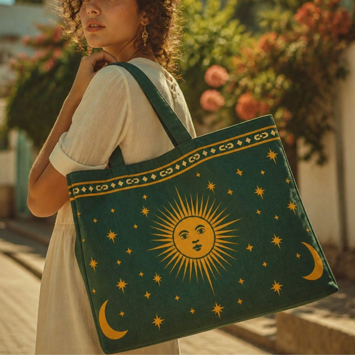 Astra celestial tote bag over the shoulder in a rose garden