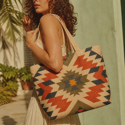 Inca aztec tote bag carried over the shoulder beside a green shutter