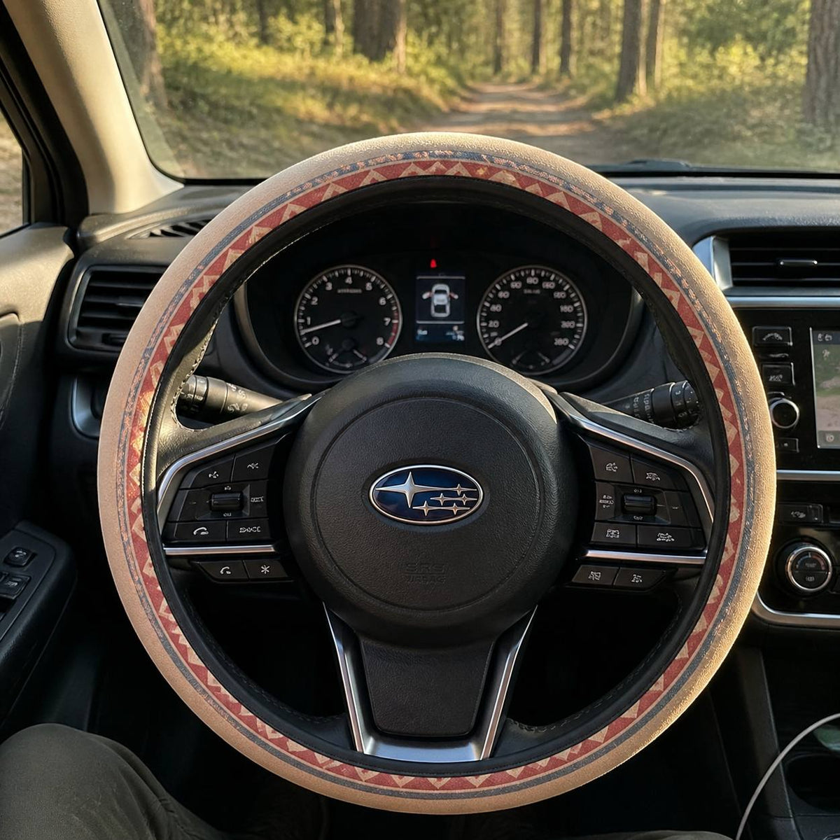 Indigo steering wheel cover by Solara on a car steering wheel, driver&