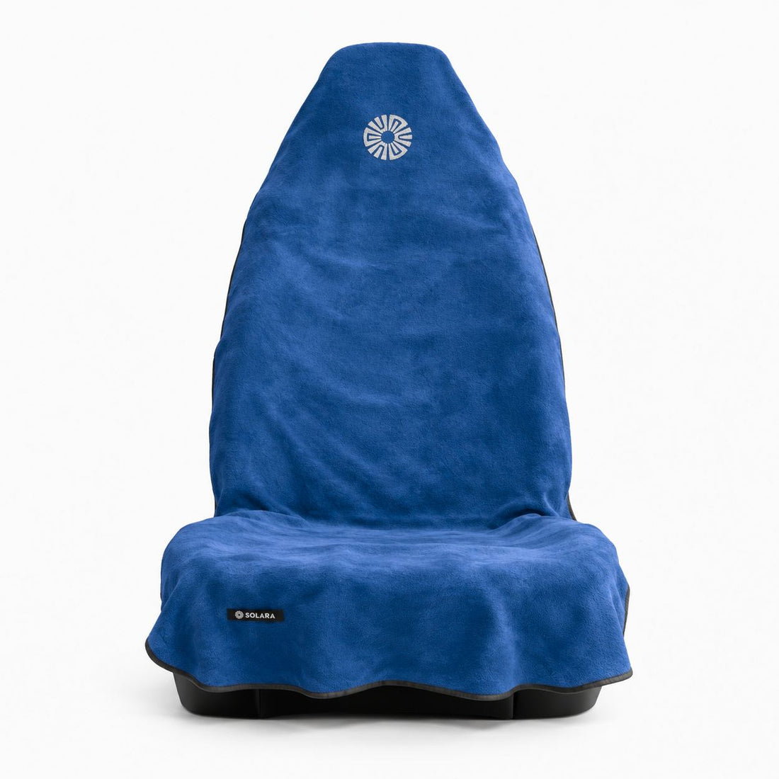 Marina blue car seat towel by Solara on a front car seat, front view with the embroidered sun logo on the hood