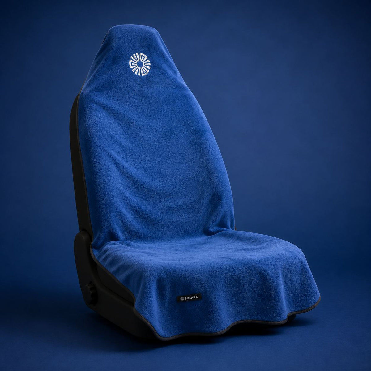 Marina blue car seat towel by Solara on a car seat, studio shot