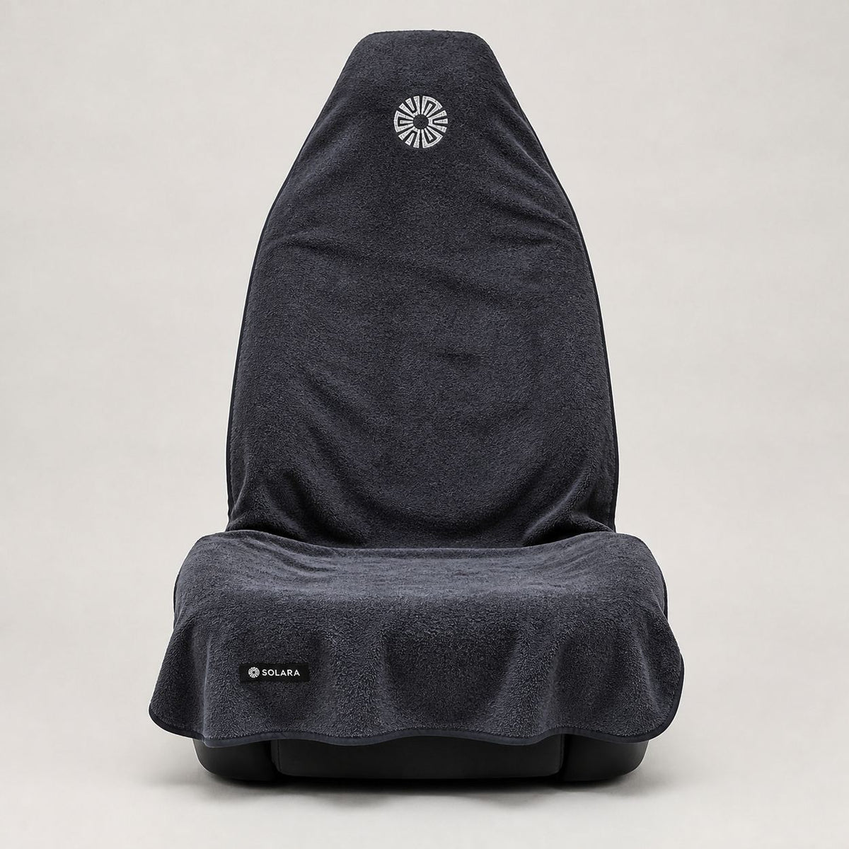 Neblina grey car seat towel by Solara covering a front car seat, front view