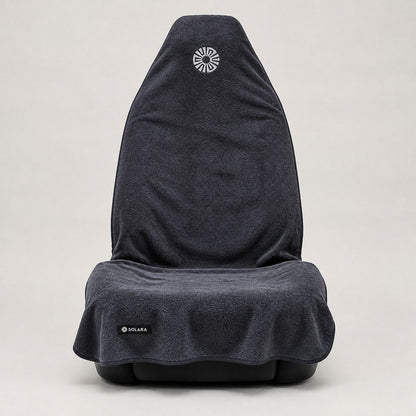 Neblina grey car seat towel by Solara covering a front car seat, front view