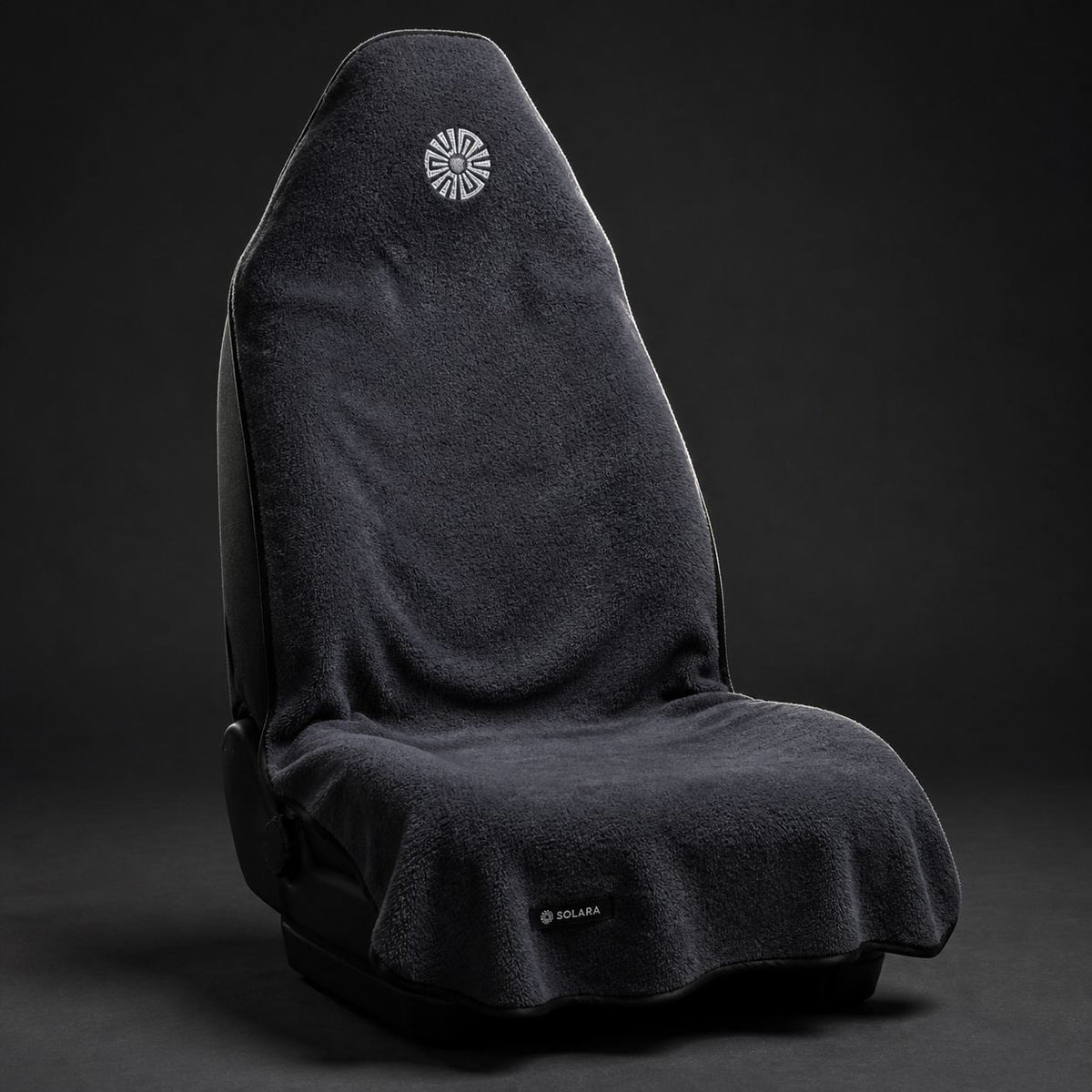 Neblina grey car seat towel by Solara on a car seat, studio shot