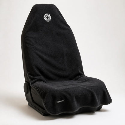 Noche black car seat towel by Solara on a car seat, angled view from the right