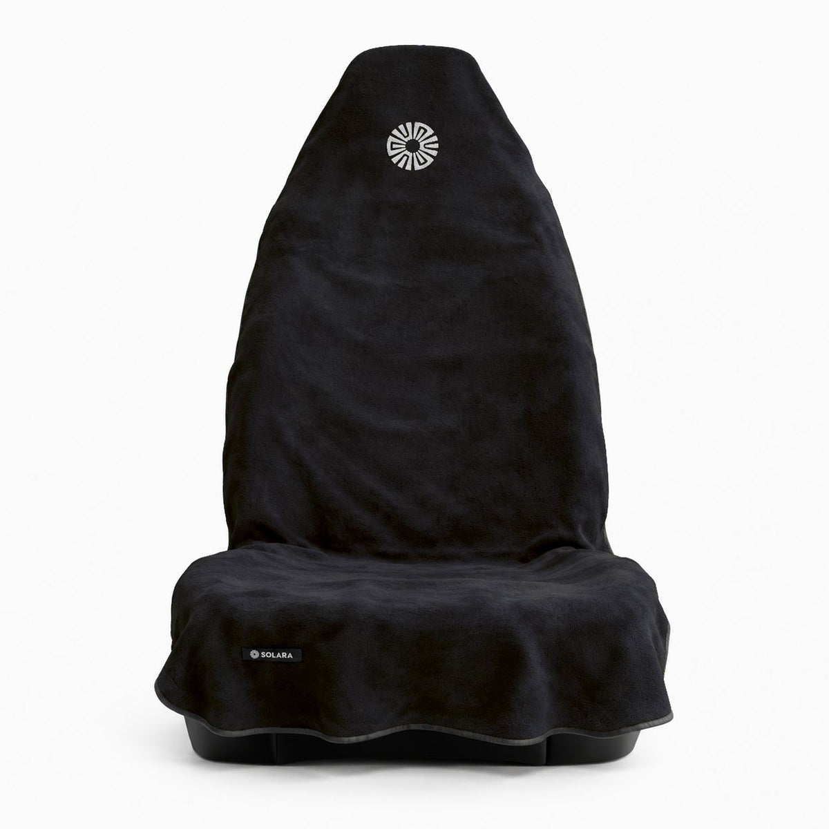 Noche black car seat towel by Solara on a front car seat, front view with the embroidered sun logo on the hood