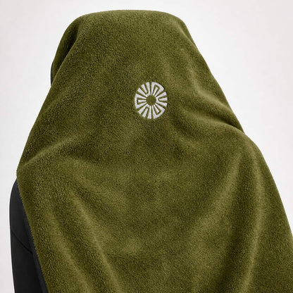 Close-up of the embroidered Solara sun logo on the hood of the Oliva olive green car seat towel