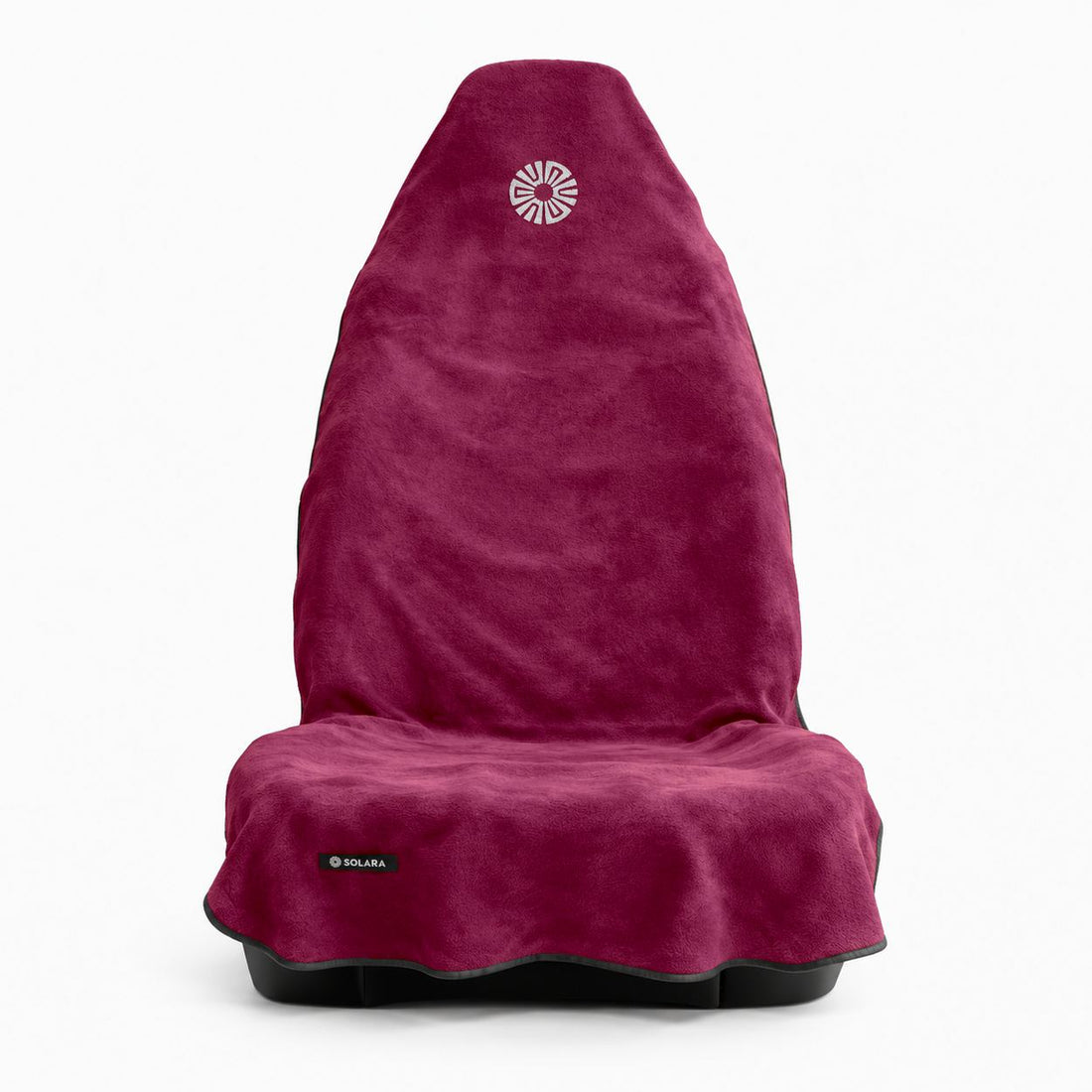 Rosa pink car seat towel by Solara on a front car seat, front view with the embroidered sun logo on the hood