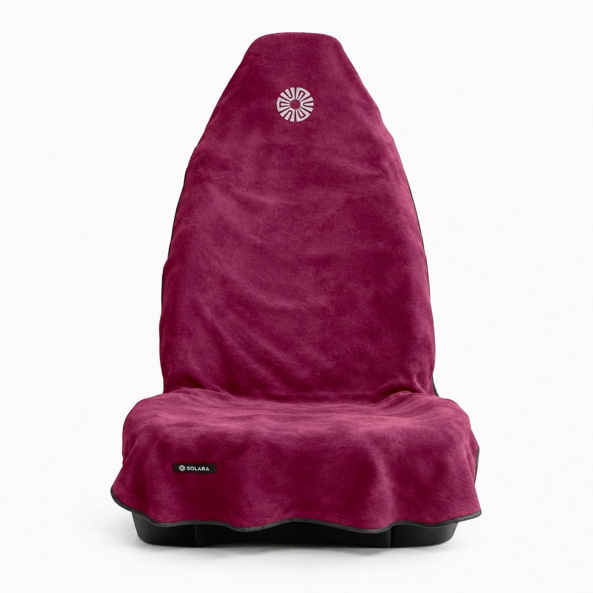 Rosa pink car seat towel by Solara on a front car seat, front view with the embroidered sun logo on the hood