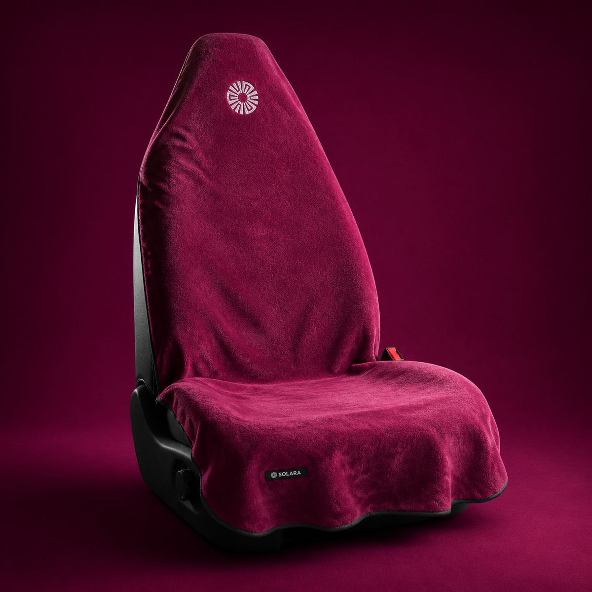 Rosa pink car seat towel by Solara on a car seat, studio shot