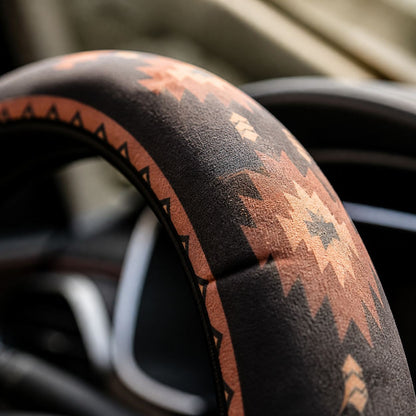 Close-up of the soft faux suede on the Zara steering wheel cover by Solara, black and orange Aztec print
